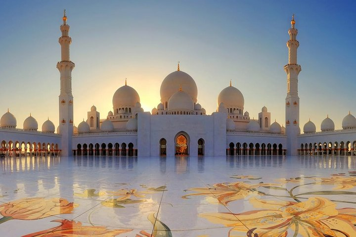 Discover the stunning architecture of Sheikh Zayed Grand Mosque where intricate designs and serene landscapes create a perfect backdrop for an unforgettable day in Abu Dhabi. Explore the rich culture and heritage.